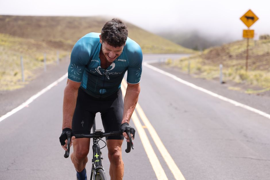 Cyclist climbing a remote mountain road