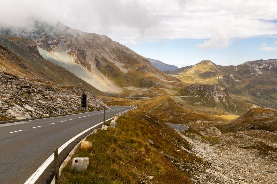 Winding Alpine pass road with mountain views